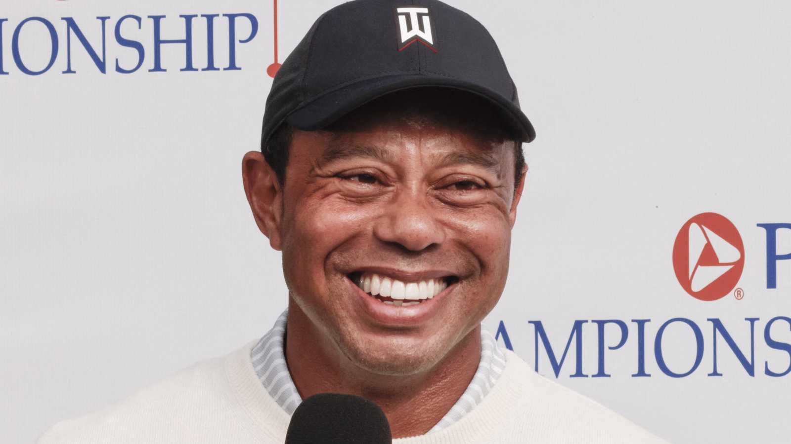 Tiger Woods chuckles to himself as he delivers Lionel Messi verdict